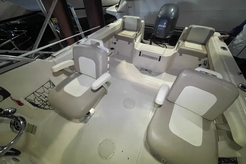 Slide: The Image of 2014 Grady-White Freedom 205 boat interior with seating and motor. - 3