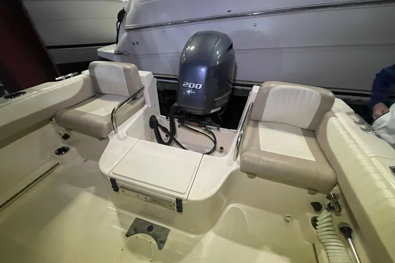 Slide: The Image of 2014 Grady-White Freedom 205 boat interior with Yamaha 200 engine. - 4