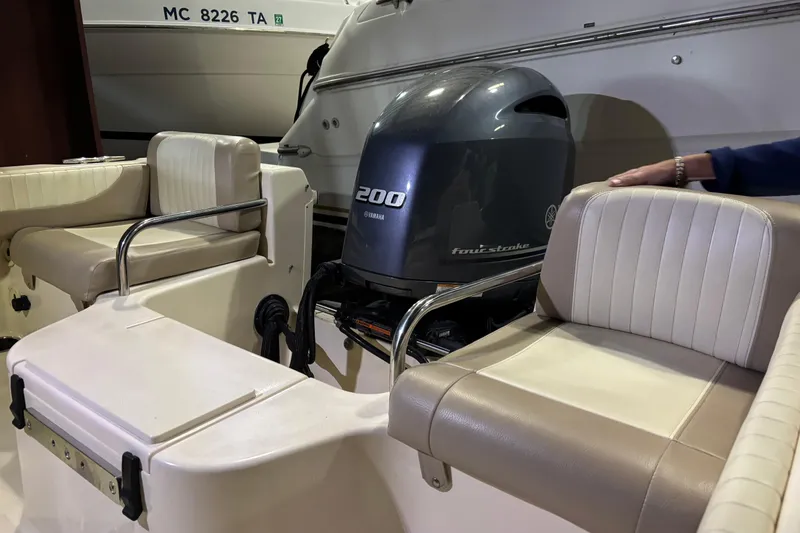 Slide: The Image of 2014 Grady-White Freedom 205 boat interior with Yamaha 200 engine. - 5