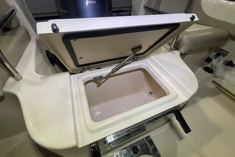 Slide: The Image of Open storage compartment on 2014 Grady-White Freedom 205 boat interior. - 6