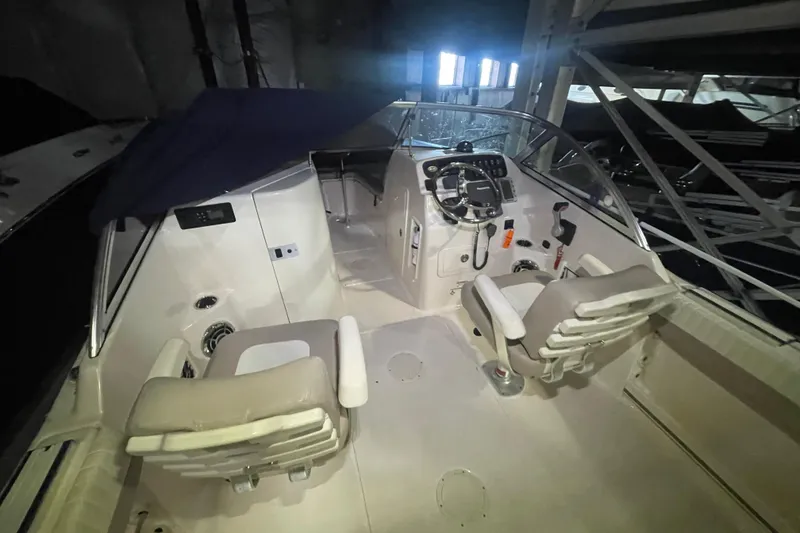 Slide: The Image of 2014 Grady-White Freedom 205 boat interior with dual seats and control panel. - 7