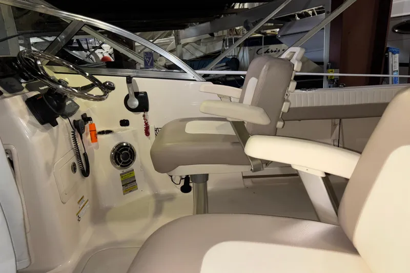 Slide: The Image of Interior of 2014 Grady-White Freedom 205 boat with steering wheel and seating. - 9