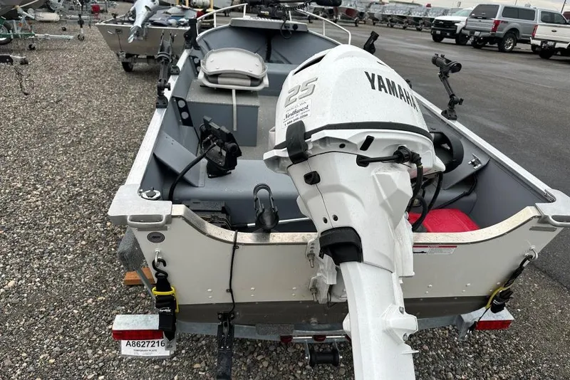 Slide: The Image of 2025 Smoker Craft 15 Alaskan Split Seat boat with Yamaha motor, parked on gravel. - 4