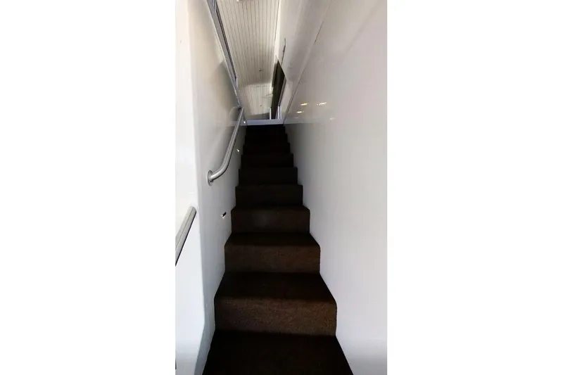 Slide: The Image of Narrow staircase inside Adonia Radiance Share #3, 2022 model, with white walls and brown carpet. - 22