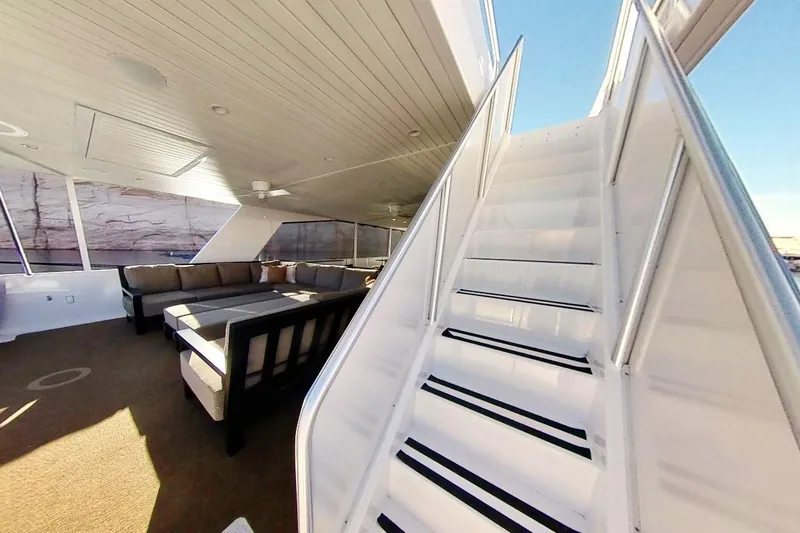 Slide: The Image of Luxurious interior of 2022 Adonia Radiance Share #3 yacht with modern seating and staircase. - 33