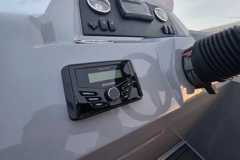 Slide: The Image of Control panel of 2026 Veranda Vista 22RC boat with Kicker media center. - 16