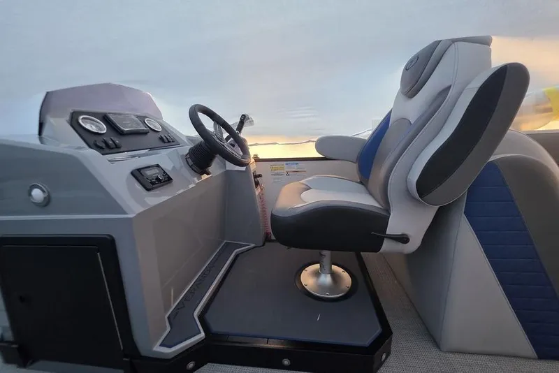 Slide: The Image of 2026 Veranda Vista 22RC boat interior with modern steering console and comfortable seating. - 17