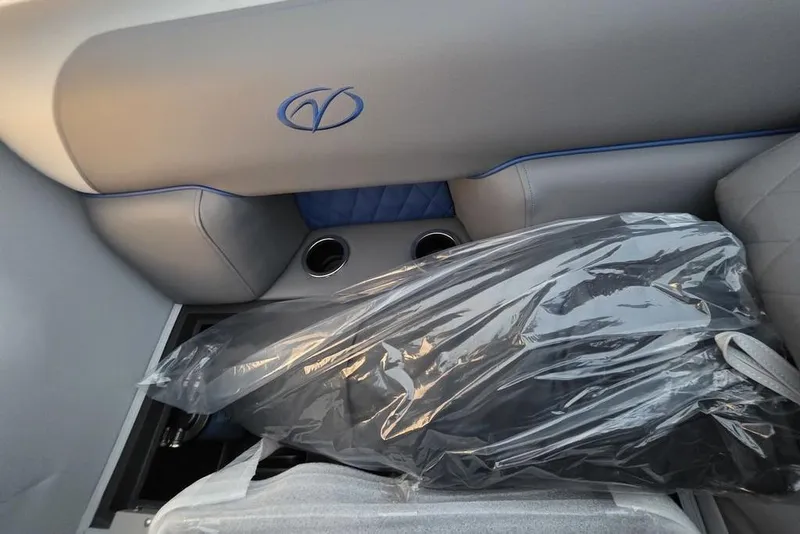 Slide: The Image of 2026 Veranda Vista 22RC interior with logo, cup holders, and plastic-covered seats. - 18