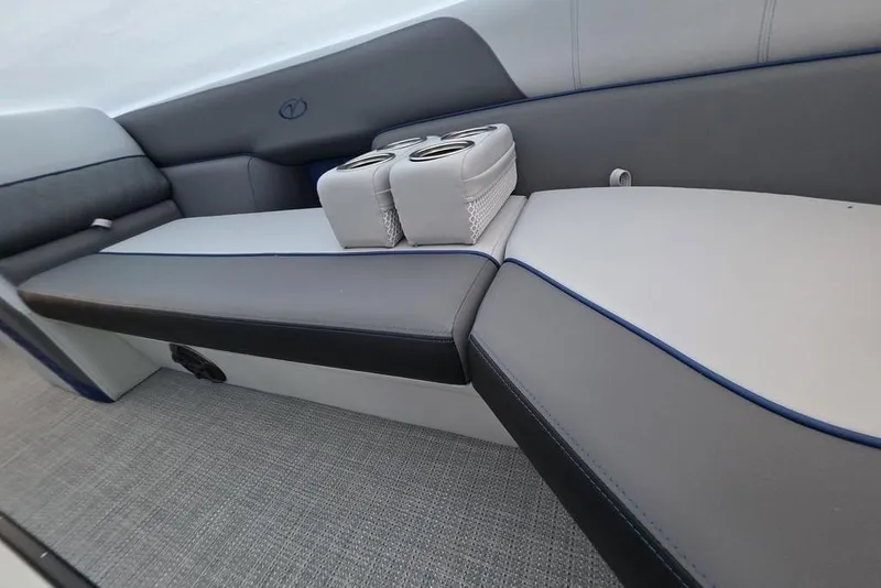 Slide: The Image of 2026 Veranda Vista 22RC boat interior with sleek seating and cup holders. - 2