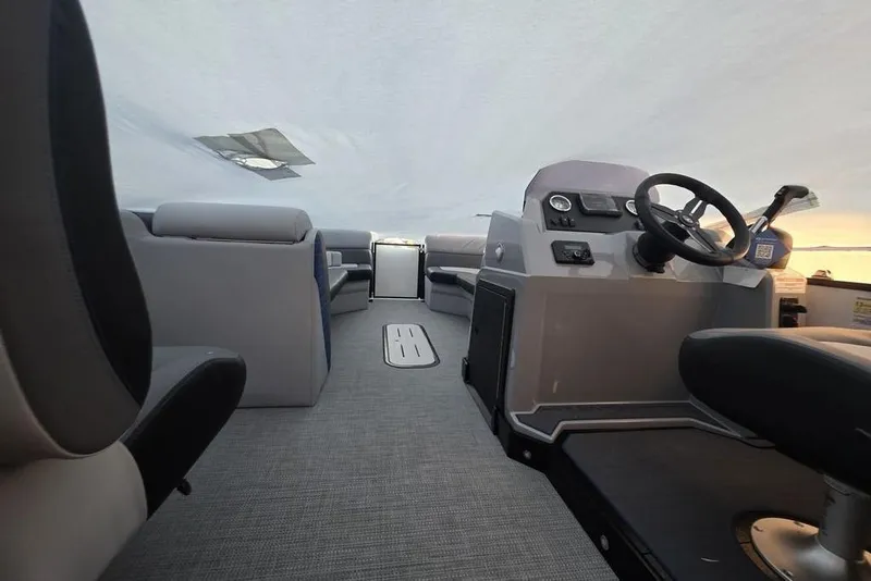 Slide: The Image of 2026 Veranda Vista 22RC boat interior with modern seating and steering console. - 21