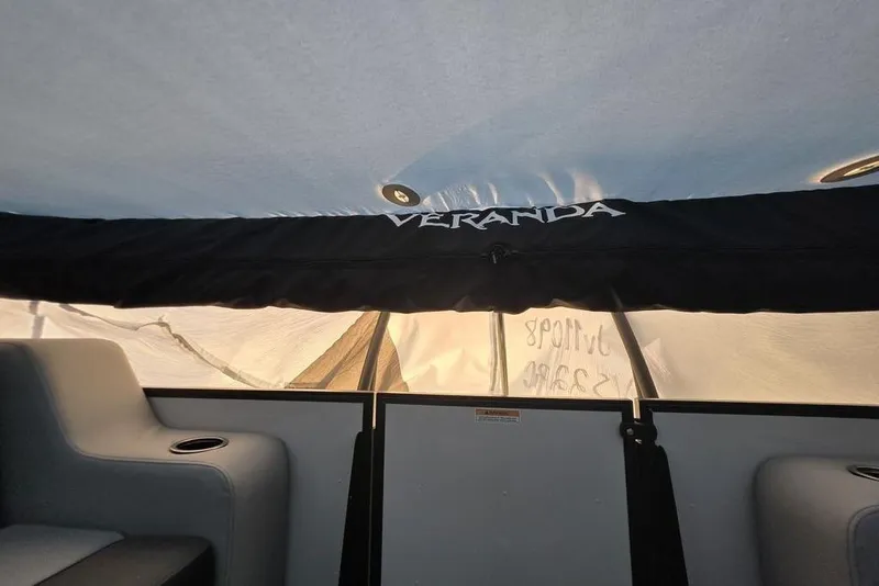 Slide: The Image of Interior view of 2026 Veranda Vista 22RC boat with seating and canopy. - 23