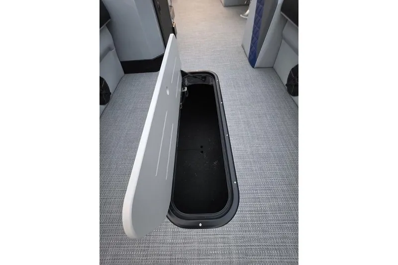 Slide: The Image of Open storage compartment in 2026 Veranda Vista 22RC boat interior. - 9