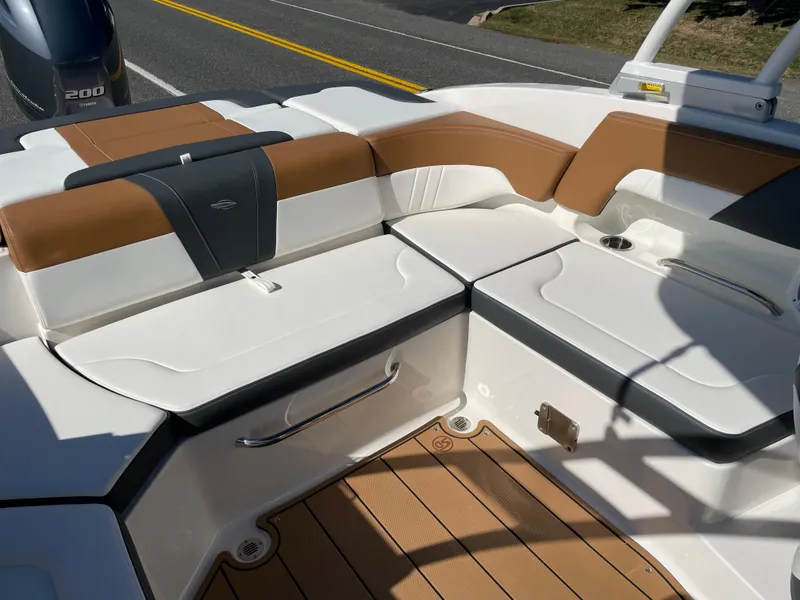Slide: The Image of 2024 Chaparral 23 SSi OB boat interior with tan and white seating. - 29