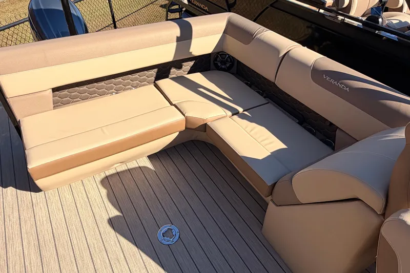 Slide: The Image of 2026 Veranda VR 235 L boat interior with beige cushioned seating and stylish design. - 14