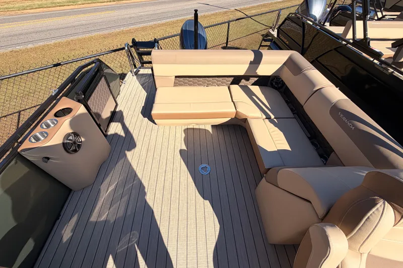 Slide: The Image of 2026 Veranda VR 235 L pontoon boat with beige seating and spacious deck layout. - 15