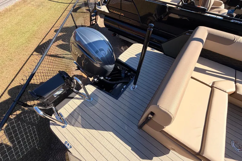 Slide: The Image of 2026 Veranda VR 235 L boat with outboard motor and beige seating on deck. - 16