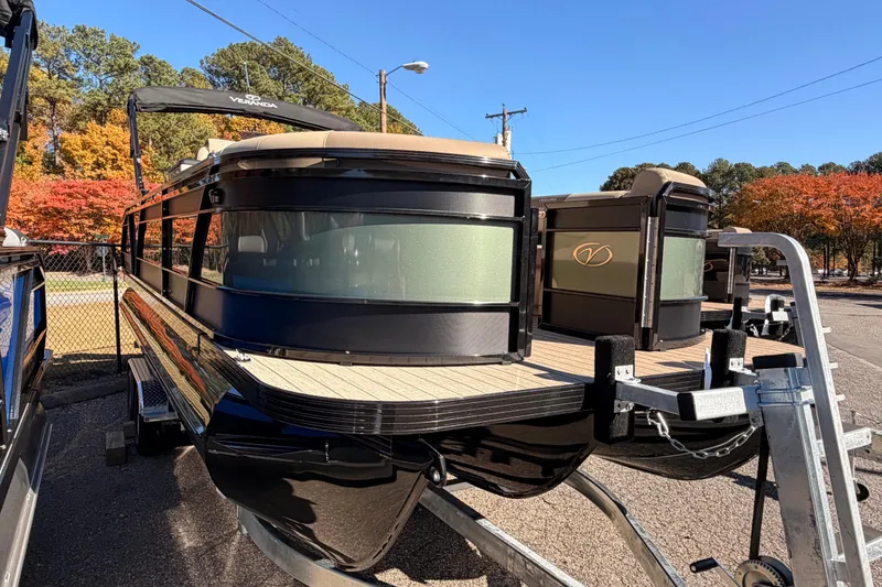 Slide: The Image of 2026 Veranda VR 235 L pontoon boat on trailer, surrounded by autumn trees. - 4