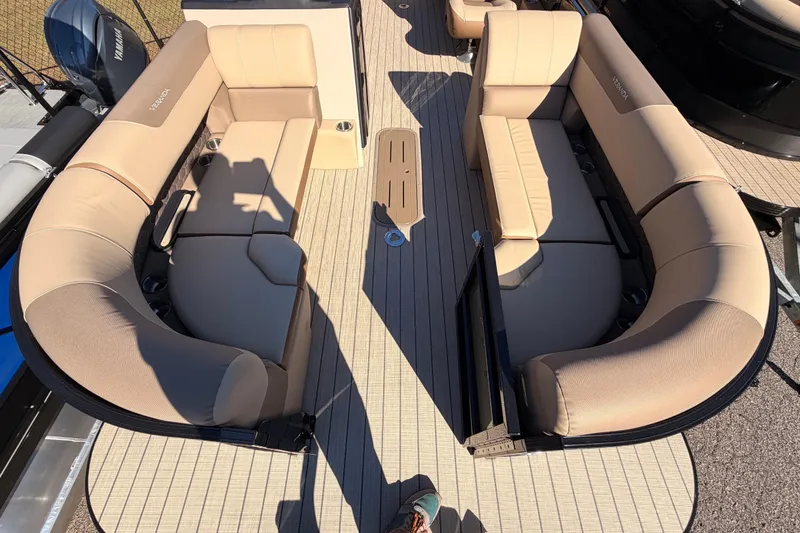 Slide: The Image of 2026 Veranda VR 235 L boat interior with beige seating and wood flooring. - 6