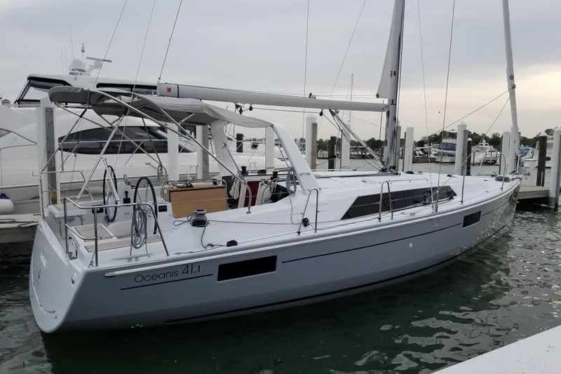 The Image of 2017 Beneteau Oceanis 41.1 sailboat docked at marina, side view. - 1