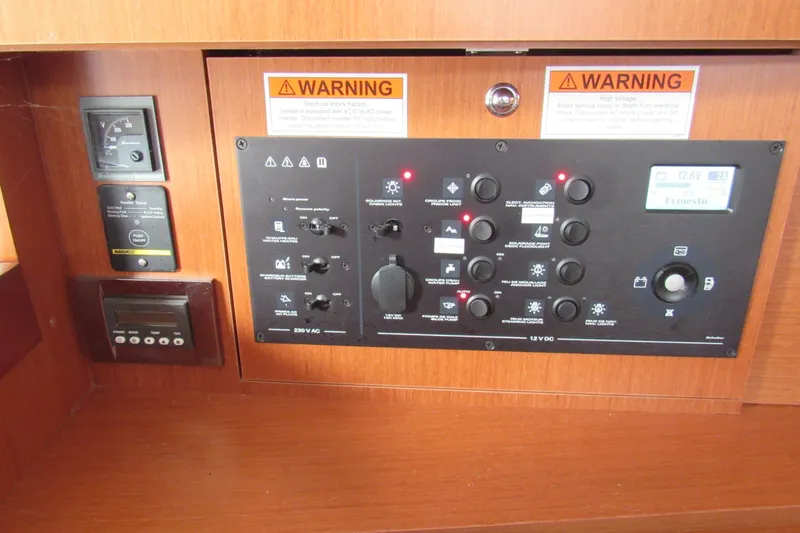 Slide: The Image of Control panel of a 2017 Beneteau Oceanis 41.1 sailboat with warning labels. - 25