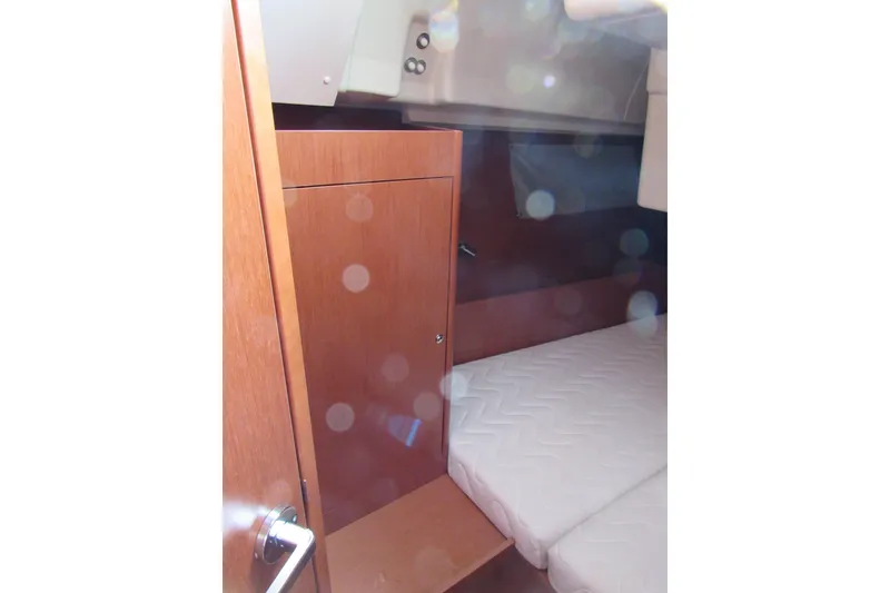 Slide: The Image of 2017 Beneteau Oceanis 41.1 cabin interior with wooden cabinetry and bed. - 26
