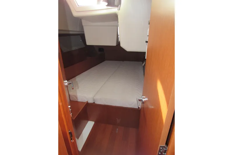 Slide: The Image of 2017 Beneteau Oceanis 41.1 cabin interior with bed and wooden finish. - 27