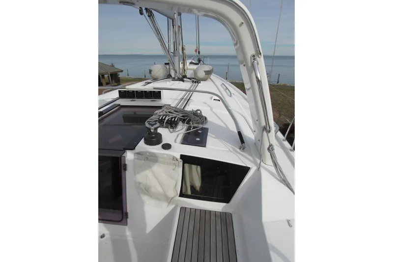 Slide: The Image of 2017 Beneteau Oceanis 41.1 yacht deck with winch and ropes, overlooking the sea. - 34