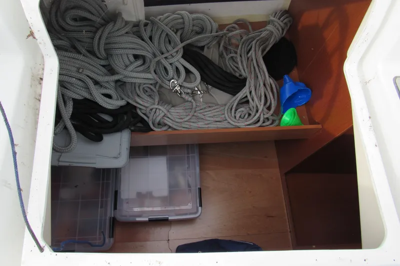 Slide: The Image of Storage compartment on a 2017 Beneteau Oceanis 41.1 with ropes and containers. - 47