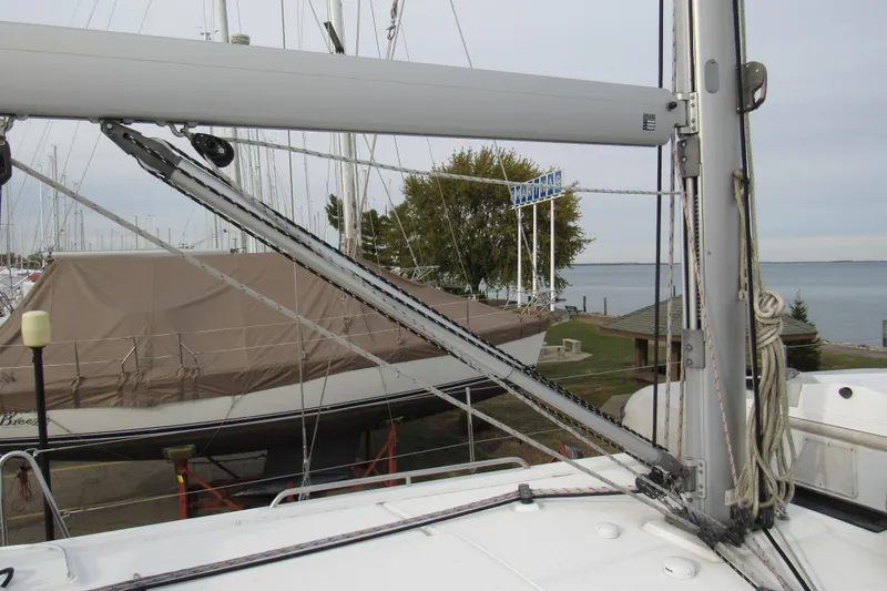 Slide: The Image of 2017 Beneteau Oceanis 41.1 sailboat mast and rigging at marina, docked near water. - 50