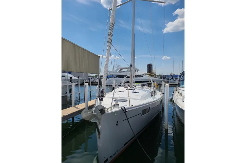Slide: The Image of 2017 Beneteau Oceanis 41.1 sailboat docked at marina under clear blue sky. - 7