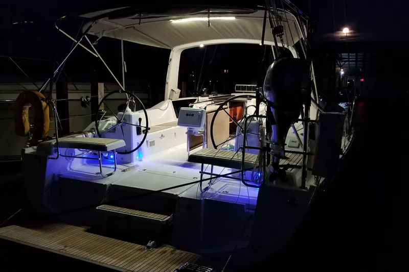 Slide: The Image of 2017 Beneteau Oceanis 41.1 yacht illuminated at night, showcasing modern design and elegance. - 8