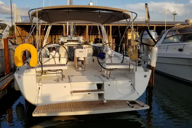 Slide: The Image of 2017 Beneteau Oceanis 41.1 sailboat docked at marina, rear view. - 9