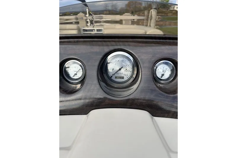 Slide: The Image of Dashboard gauges of a 2018 Bennington 23SLX boat. - 8