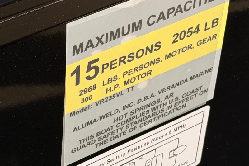 Slide: The Image of 2026 Veranda VR235VL boat capacity label, 15 persons, 2054 lbs, 300 HP motor. - 10