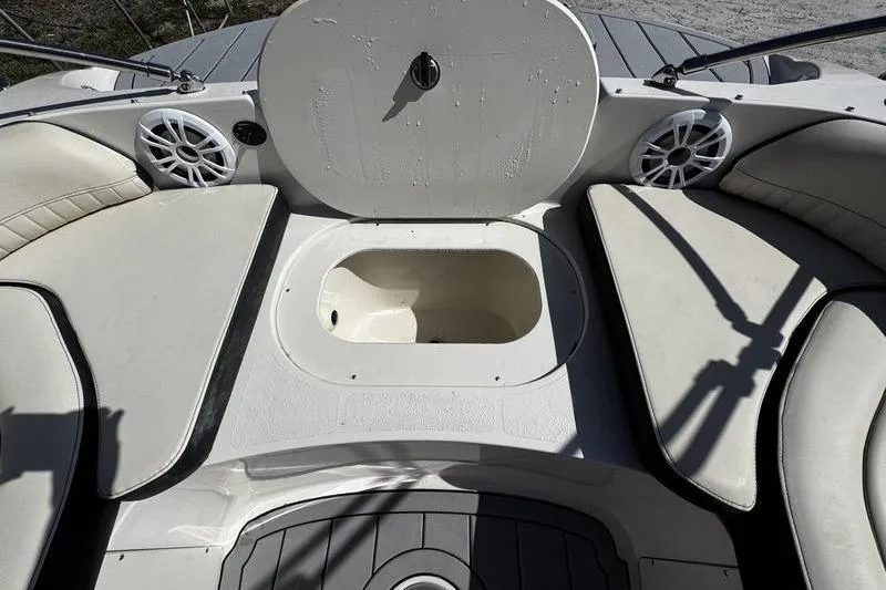 Slide: The Image of 2022 Stingray 212SC boat interior with seating and storage compartment. - 10