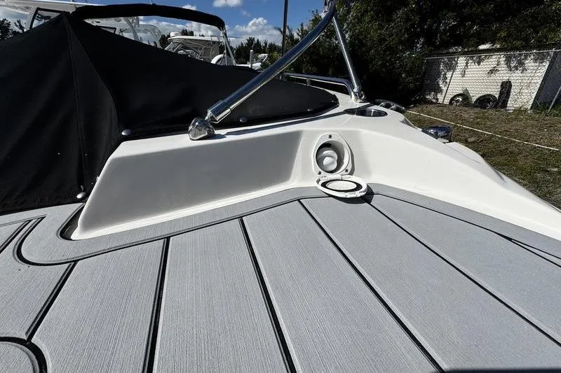 Slide: The Image of 2022 Stingray 212SC boat deck with sleek design and modern features. - 5