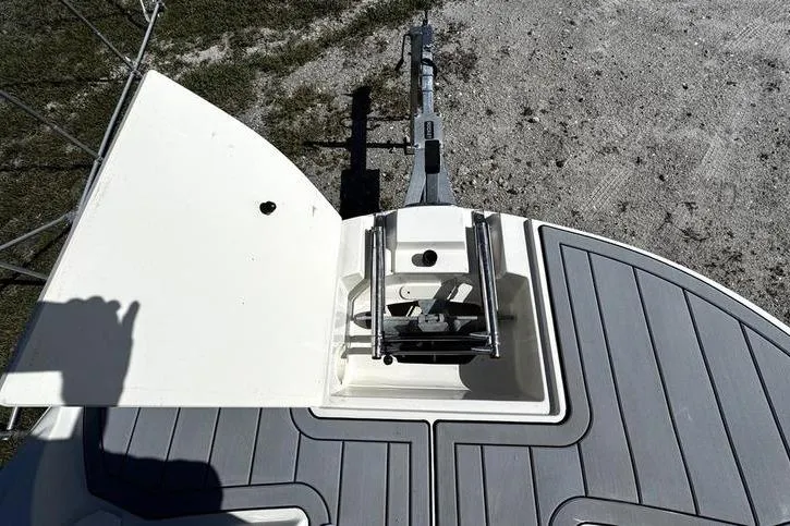 Slide: The Image of 2022 Stingray 212SC boat with open hatch and ladder on deck. - 6