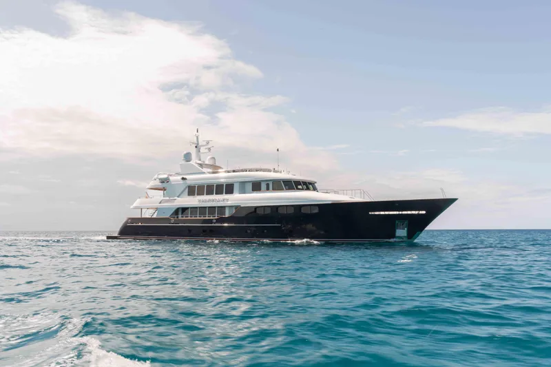The Image of Trinity Yachts 2004 motor yacht cruising on open sea under clear skies. - 0