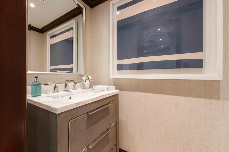 Slide: The Image of Luxurious bathroom on 2004 Trinity Yachts motor yacht with modern decor and elegant fixtures. - 12