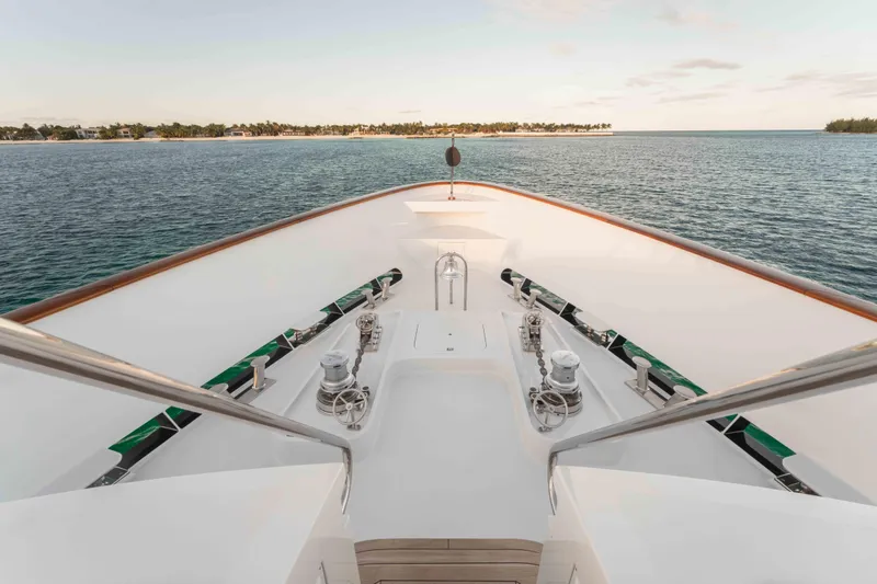 Slide: The Image of Bow view of 2004 Trinity Yachts motor yacht on serene ocean waters. - 37