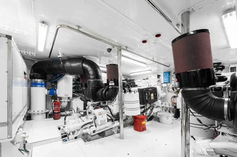 Slide: The Image of Engine room of 2004 Trinity Yachts Motor Yacht, featuring advanced machinery and equipment. - 42