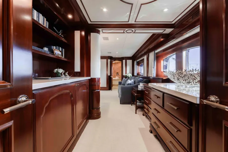 Slide: The Image of Luxurious interior of 2004 Trinity Yachts motor yacht with elegant wood finishes and modern decor. - 7