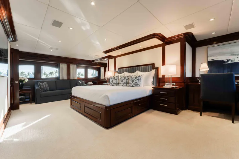 Slide: The Image of Luxurious bedroom interior on 2004 Trinity Yachts motor yacht, featuring elegant wood finishes. - 8