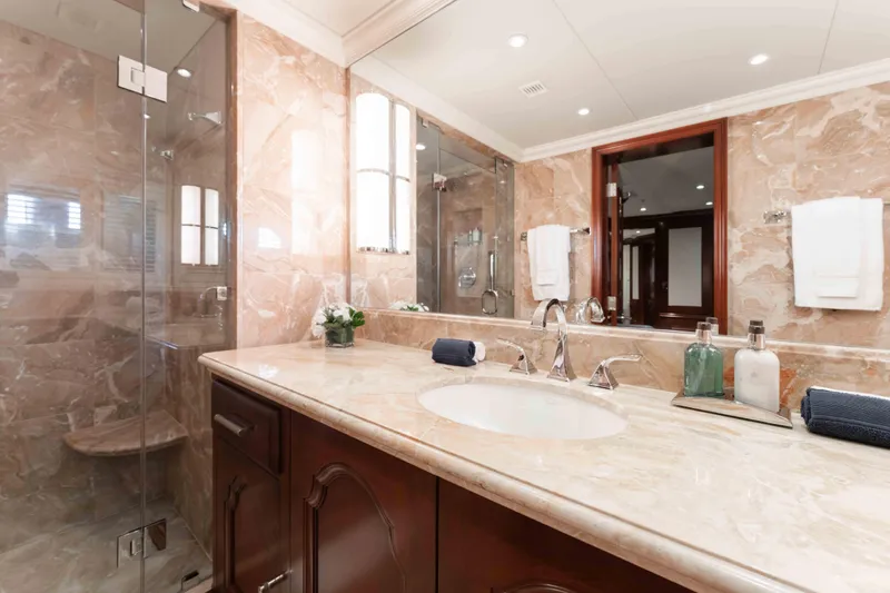 Slide: The Image of Luxurious marble bathroom in 2004 Trinity Yachts motor yacht, featuring elegant fixtures and decor. - 21