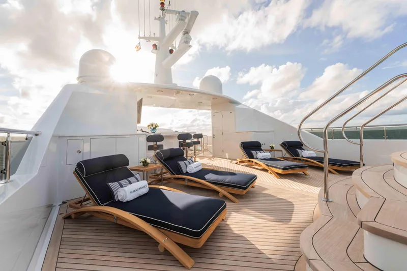 Slide: The Image of Luxurious deck of 2004 Trinity Yachts motor yacht with sun loungers and ocean view. - 28