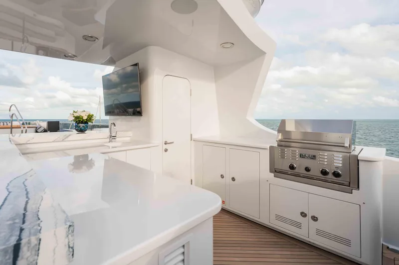 Slide: The Image of Luxurious outdoor kitchen on 2004 Trinity Yachts motor yacht with ocean view. - 29