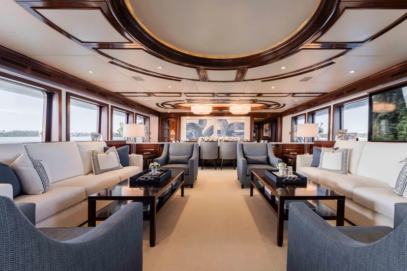 Slide: The Image of Luxurious interior of 2004 Trinity Yachts motor yacht with elegant seating and wood accents. - 4