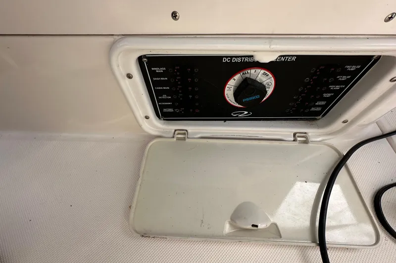 Slide: The Image of DC distribution center on a 2006 Regal Commodore 2665 boat, featuring control panel and switches. - 16