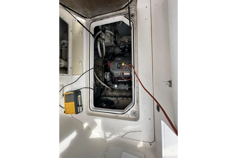 Slide: The Image of Engine compartment of a 2006 Regal Commodore 2665 boat, featuring a Volvo Penta engine. - 18