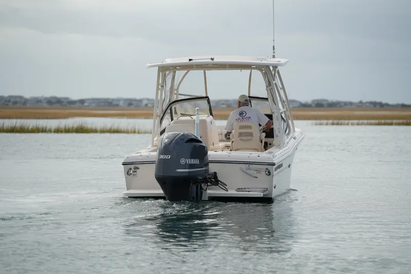 Slide: The Image of 2016 Grady-White Freedom 225 boat with Yamaha engine on calm water. - 5